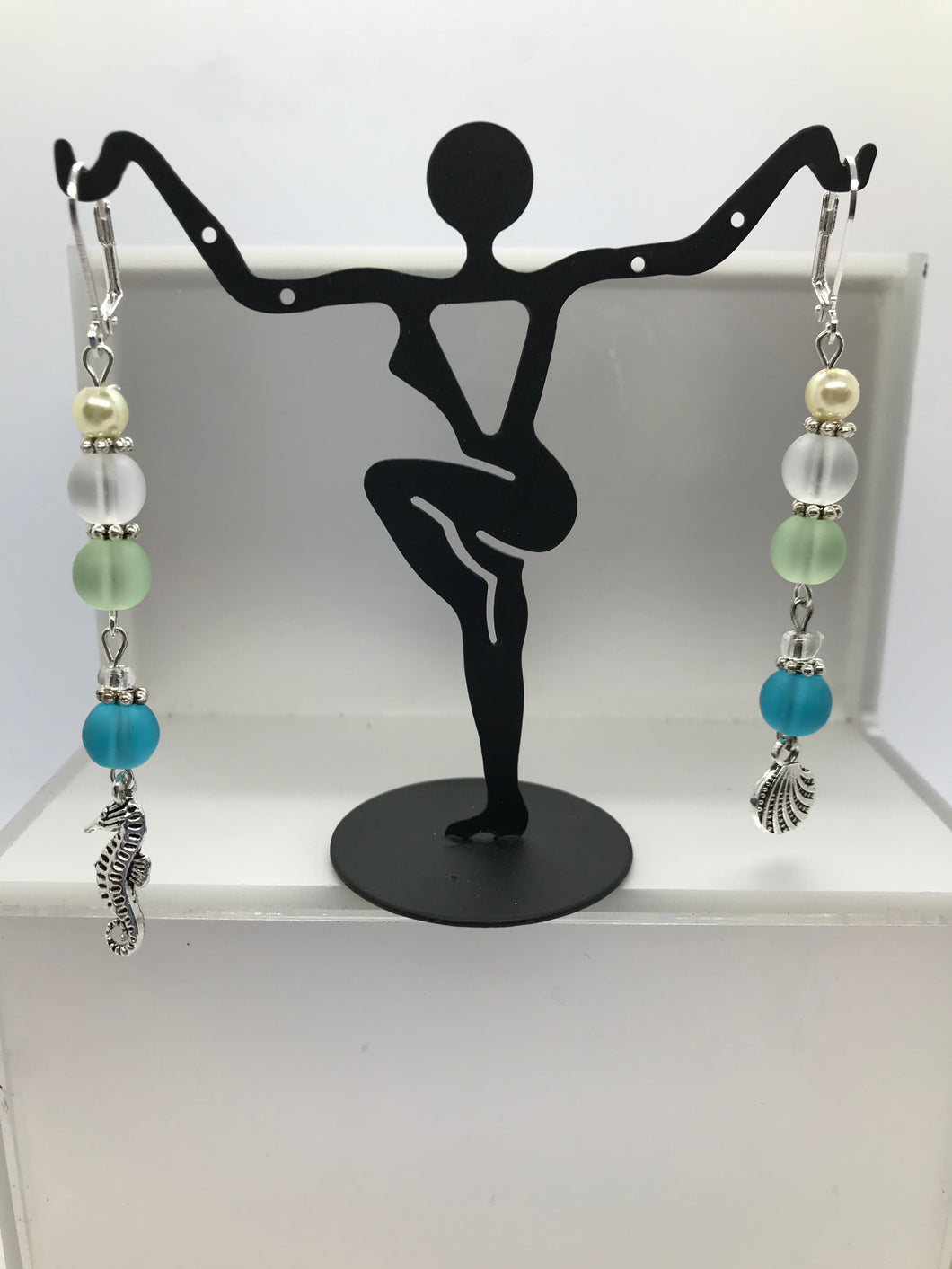 Beach glass dangling earrings with charms