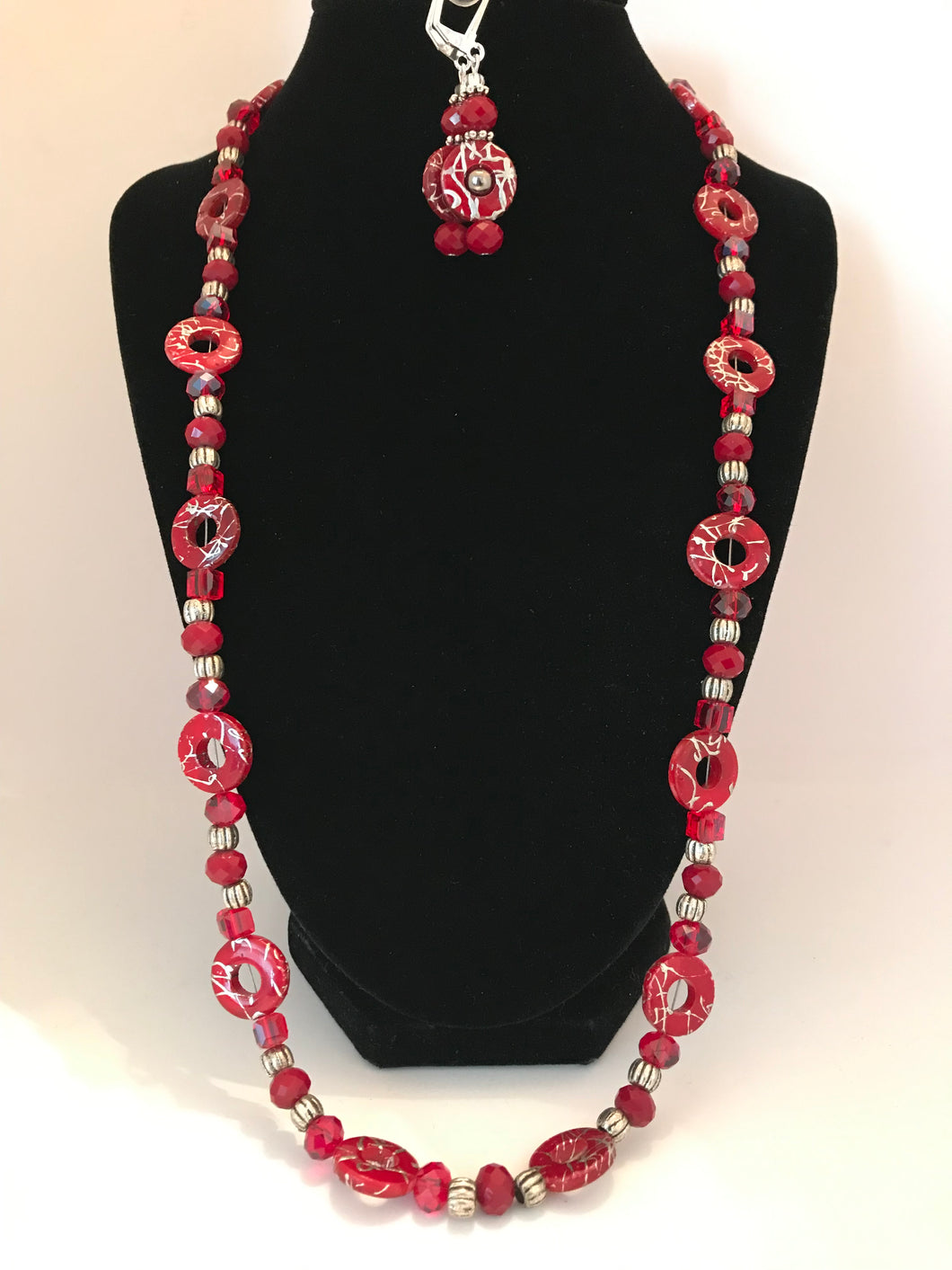 Red necklace with novelty round beads and matching earrings