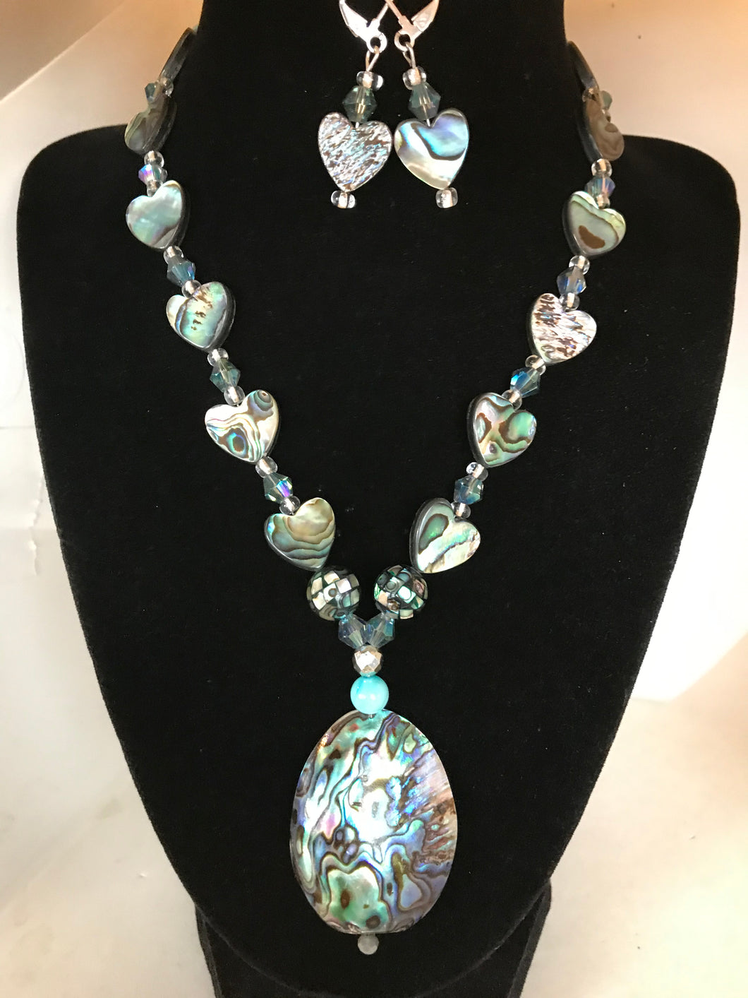 Abalone necklace with hearts and earrings.