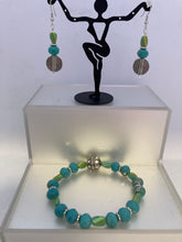 Load image into Gallery viewer, Glass faceted aqua and green stretch bracelet with matching earrings set.
