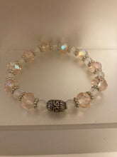 Load image into Gallery viewer, Glass faceted pale pink and clear opal beaded stretch bracelet, with matching earrings.
