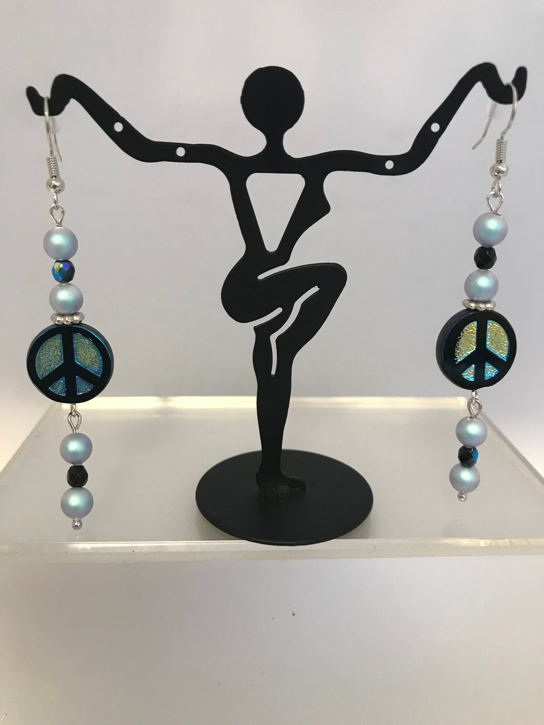 Dangling peace sign earrings