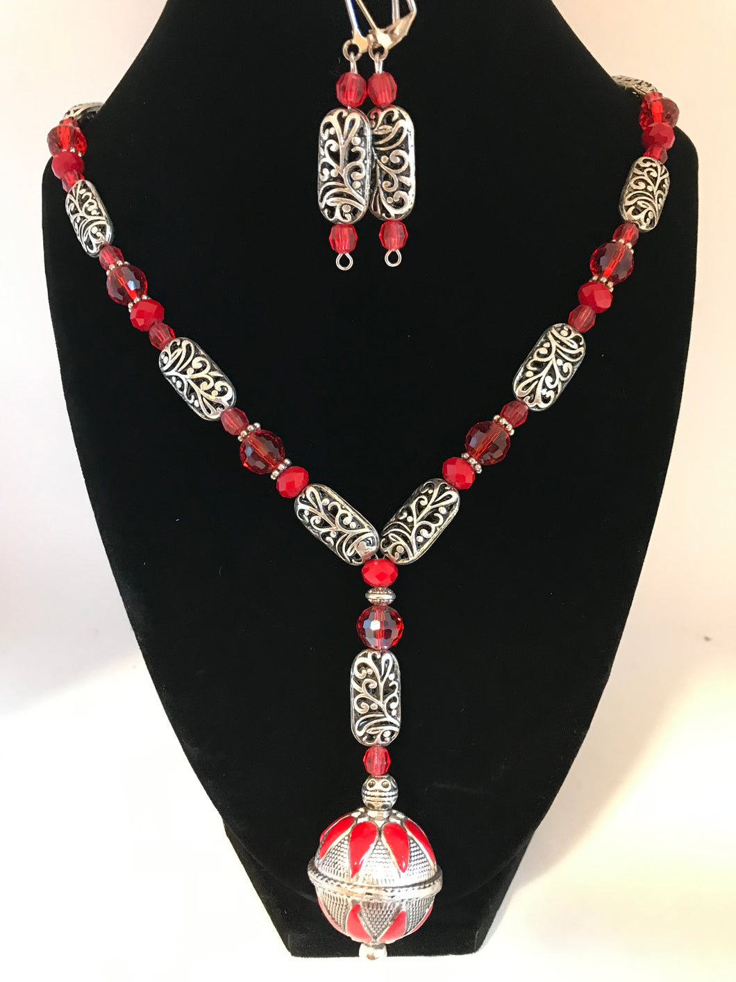 Novelty dangling pendant with assorted red glass and metal beads necklace with matching earrings