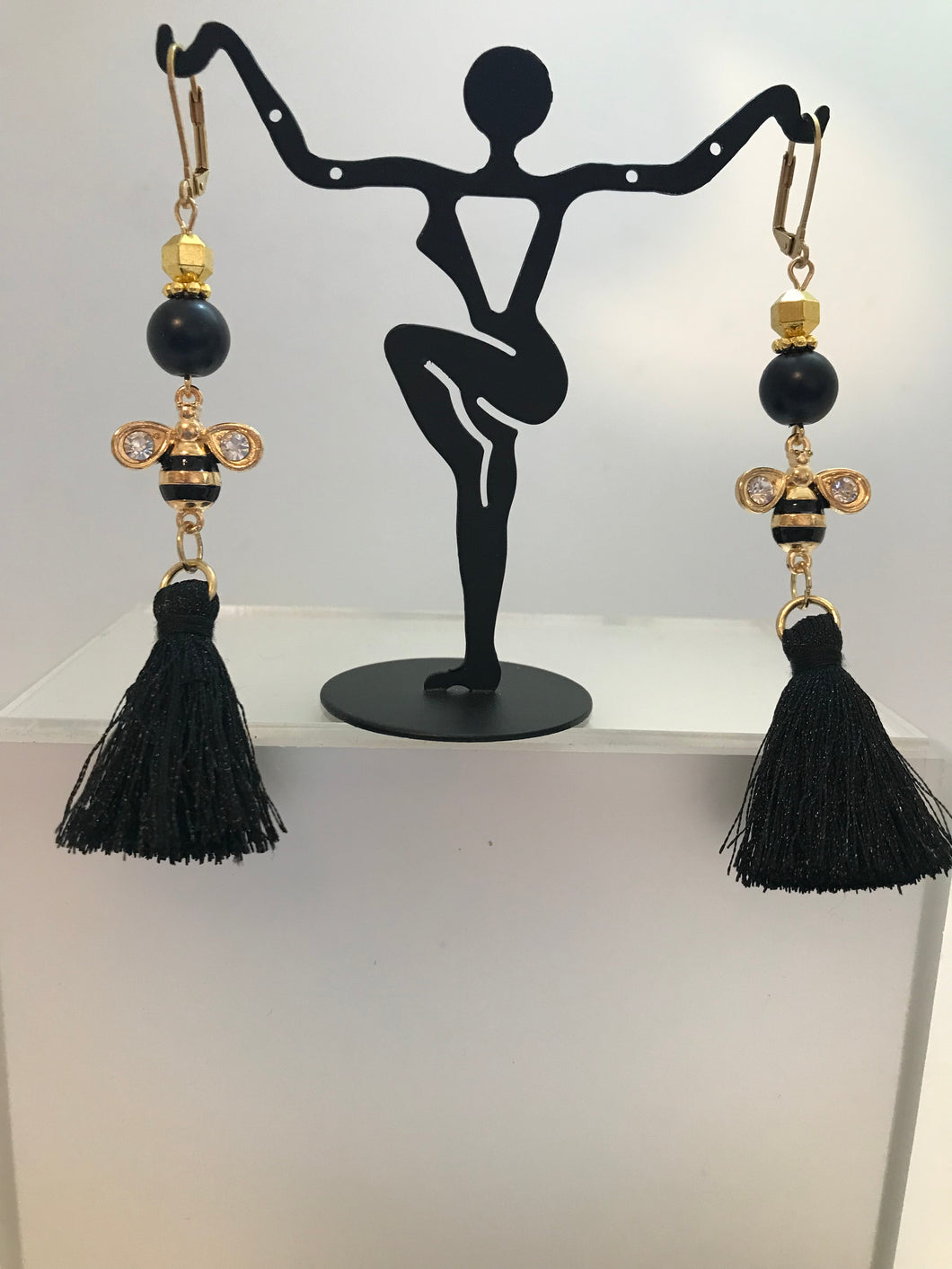 Long black tassel earrings with bumble bee charms