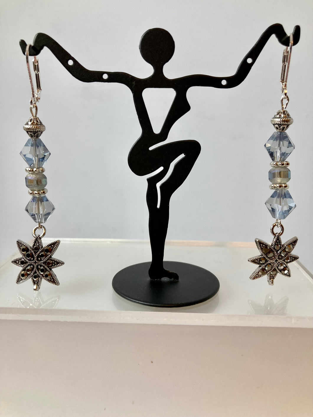 Crystal and silver metal star earrings