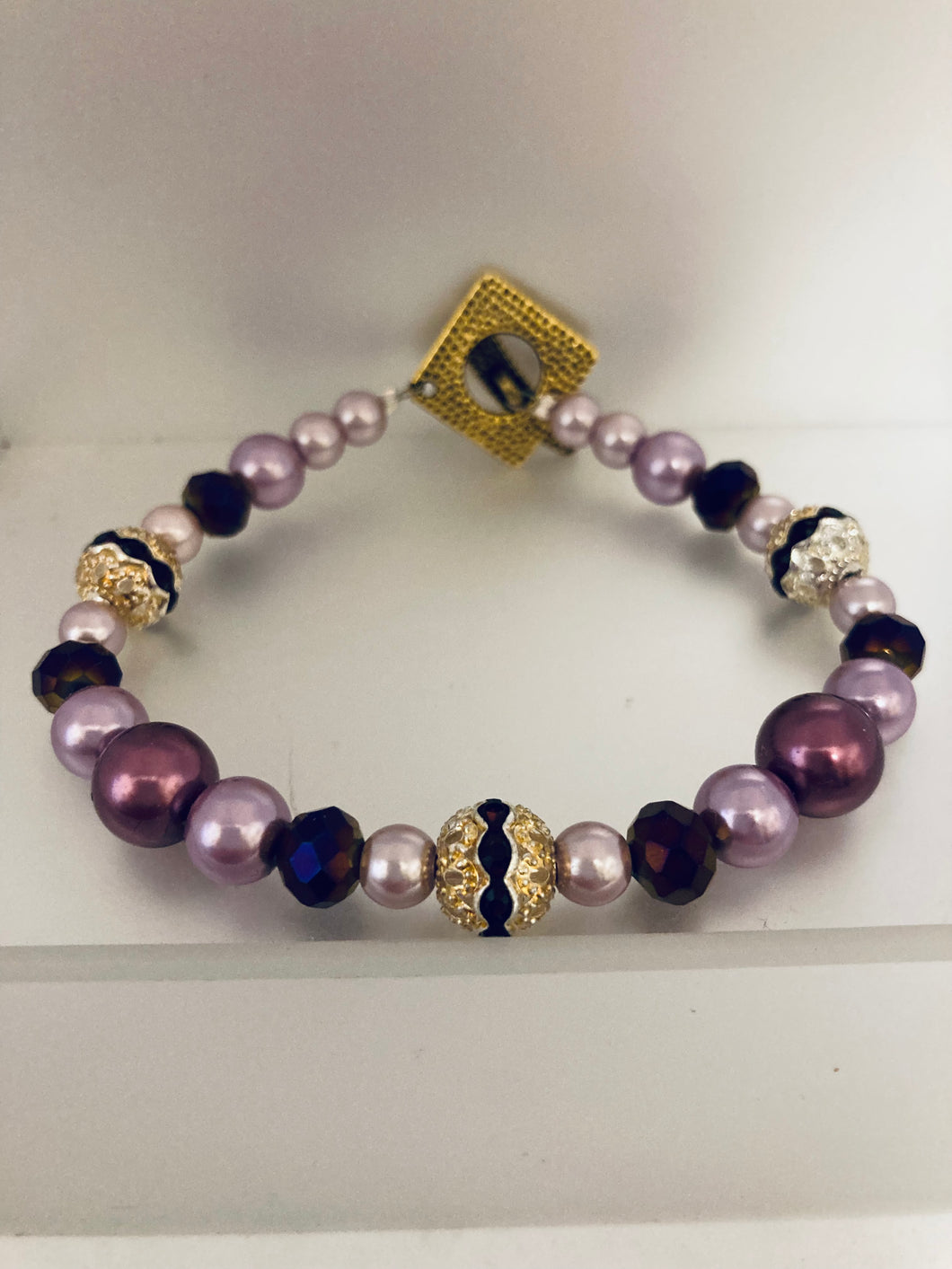 Assorted novelty beaded bracelet with gold toggle closure