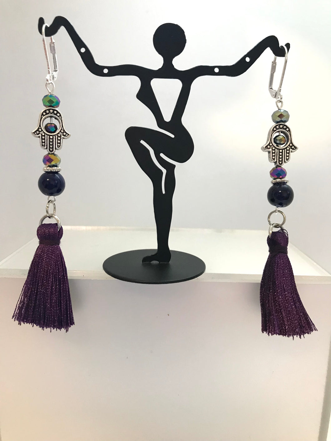 Purple tassel earrings with hamsa charms